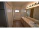 Bathroom featuring dual sinks, a bathtub, and a closet at 5125 W Reno Ave # 1059, Las Vegas, NV 89118