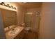 Clean bathroom with vanity, mirror, toilet, and a shower-tub combo at 5125 W Reno Ave # 1059, Las Vegas, NV 89118