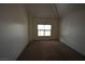 A bright and spacious bedroom is naturally lit with a large window and carpet flooring at 5125 W Reno Ave # 1059, Las Vegas, NV 89118