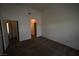 Spacious bedroom with neutral walls, carpet flooring, and open doorway at 5125 W Reno Ave # 1059, Las Vegas, NV 89118