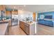 Open concept kitchen with stainless steel appliances, a center island, and modern wood cabinets at 551 Ruby Robin Ave # Lot 750, Henderson, NV 89011
