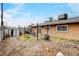 The backyard shows the fence, shed, patio and sliding glass door at 5900 Fawn Ave, Las Vegas, NV 89107