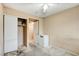 Bedroom features neutral walls, closet, adjacent room access and carpeted floors at 5900 Fawn Ave, Las Vegas, NV 89107