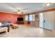 Living room showing window, exterior door, ceiling fan, and view of backyard at 5900 Fawn Ave, Las Vegas, NV 89107