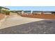 A large, vacant backyard with a brick perimeter wall, offering privacy and customization possibilities at 5947 Wellington Peak Rd, Las Vegas, NV 89148