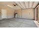 This garage features a water heater, storage tanks, and an automatic door at 5947 Wellington Peak Rd, Las Vegas, NV 89148