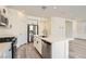 Modern kitchen features stainless steel appliances, a center island, and a gas cooktop at 5947 Wellington Peak Rd, Las Vegas, NV 89148