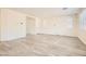 Bright living room featuring wood-look flooring and plenty of natural light at 5947 Wellington Peak Rd, Las Vegas, NV 89148