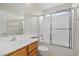 Bathroom featuring a bathtub and shower with glass sliding doors at 644 Wind Cave Ct, Henderson, NV 89012