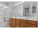 Bathroom with double sink vanity and shower-tub combo at 644 Wind Cave Ct, Henderson, NV 89012