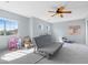 This bedroom offers natural light and a ceiling fan at 644 Wind Cave Ct, Henderson, NV 89012