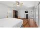 Cozy bedroom featuring hardwood floors, a ceiling fan, and natural light at 644 Wind Cave Ct, Henderson, NV 89012