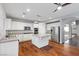 Well-lit kitchen with island, stainless appliances, and hardwood flooring at 644 Wind Cave Ct, Henderson, NV 89012