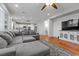 Open-concept living room with hardwood floors and seamless transition to the kitchen at 644 Wind Cave Ct, Henderson, NV 89012