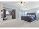 This spacious main bedroom features neutral colors, a ceiling fan, and natural light at 644 Wind Cave Ct, Henderson, NV 89012