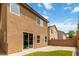 The backyard has artificial turf, a block wall, and the rear of the home at 7345 Chesapeake Cove St, Las Vegas, NV 89166