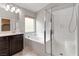 Bathroom featuring single sink, soaking tub, and glass shower enclosure at 7345 Chesapeake Cove St, Las Vegas, NV 89166