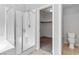 Bathroom featuring glass shower enclosure, separate toilet, and walk-in closet at 7345 Chesapeake Cove St, Las Vegas, NV 89166