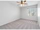 Bedroom featuring carpet, neutral walls, a window, and a ceiling fan at 7345 Chesapeake Cove St, Las Vegas, NV 89166