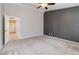 Neutral Primary bedroom featuring a neutral wall color and carpeted floors at 7345 Chesapeake Cove St, Las Vegas, NV 89166