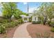 Inviting community park features walking path, pergola, bench, and lush landscaping at 7345 Chesapeake Cove St, Las Vegas, NV 89166