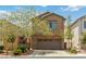 Charming two-story home with a two car garage and beautiful landscaping in a suburban neighborhood at 7345 Chesapeake Cove St, Las Vegas, NV 89166