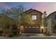 Charming two-story home with a two car garage and beautiful landscaping in a suburban neighborhood at 7345 Chesapeake Cove St, Las Vegas, NV 89166