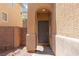Inviting front door entrance with brick accents and landscaped surroundings at 7345 Chesapeake Cove St, Las Vegas, NV 89166