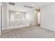 Bright, neutral hallway with carpet, white railing and walls, and plenty of natural light at 7345 Chesapeake Cove St, Las Vegas, NV 89166