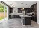 Modern kitchen with stainless steel appliances, granite countertops, and a center island at 7345 Chesapeake Cove St, Las Vegas, NV 89166
