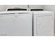 Laundry room with a new white washer and dryer at 7345 Chesapeake Cove St, Las Vegas, NV 89166