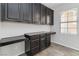 Home office features built-in shelving and desk with abundant natural light at 7345 Chesapeake Cove St, Las Vegas, NV 89166