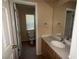 Clean bathroom featuring a single sink vanity, toilet, and neutral color scheme at 8708 Gateway Glen Dr, Las Vegas, NV 89178