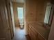 Half bathroom featuring a toilet and single sink vanity with mirror at 8708 Gateway Glen Dr, Las Vegas, NV 89178