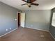 Bedroom with a ceiling fan, neutral paint, carpet, and a window with blinds at 8708 Gateway Glen Dr, Las Vegas, NV 89178