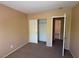 Cozy bedroom with carpet flooring, closet, and access to another room at 8708 Gateway Glen Dr, Las Vegas, NV 89178