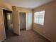 Bedroom with carpeted floor, window with blinds, closet, and neutral paint at 8708 Gateway Glen Dr, Las Vegas, NV 89178