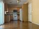 Functional kitchen with stainless steel microwave, white range, and sliding door at 8708 Gateway Glen Dr, Las Vegas, NV 89178