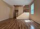 Open living space with wood floors and staircase access to the upper level at 8708 Gateway Glen Dr, Las Vegas, NV 89178