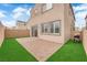 Spacious backyard featuring a brick patio, low-maintenance artificial grass and a BBQ grill at 872 Pointe Arbor St, Henderson, NV 89011