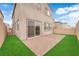 Well-maintained backyard with lush green grass and a charming brick patio, perfect for outdoor entertaining at 872 Pointe Arbor St, Henderson, NV 89011