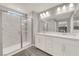 Bright bathroom with a double vanity and a glass enclosed shower at 872 Pointe Arbor St, Henderson, NV 89011