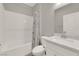 The bathroom offers a tub with shower and a white vanity with a sink and grey countertop at 872 Pointe Arbor St, Henderson, NV 89011