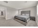 Large bedroom with a king bed and plush headboard at 872 Pointe Arbor St, Henderson, NV 89011