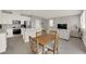 Kitchen featuring stainless appliances, white cabinets, and a stylish eat-in dining area at 872 Pointe Arbor St, Henderson, NV 89011
