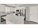 The updated kitchen has stainless steel appliances, gray backsplash, and white cabinets at 872 Pointe Arbor St, Henderson, NV 89011