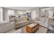Open-concept living room with neutral tones, tile floors and access to the kitchen at 872 Pointe Arbor St, Henderson, NV 89011