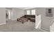 Open loft area showcasing a brown leather sectional and large square coffee table at 872 Pointe Arbor St, Henderson, NV 89011