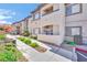 Exterior view of the condo building with well maintained landscaping and walking paths at 8725 W Flamingo Rd # 110, Las Vegas, NV 89147