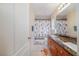 Bathroom features a double vanity with granite countertops and a themed shower curtain at 9032 Retro Ct, Las Vegas, NV 89149